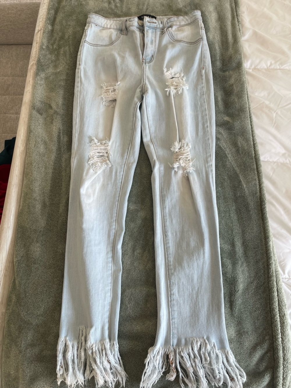 AKIRA Light Wash Distressed Flare Jeans with Fringe Hem
